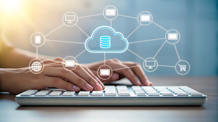Hands typing on keyboard with cloud network graphic