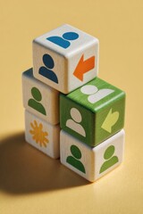 Stacked cubes with person & arrow icons, suggesting teamwork or transition