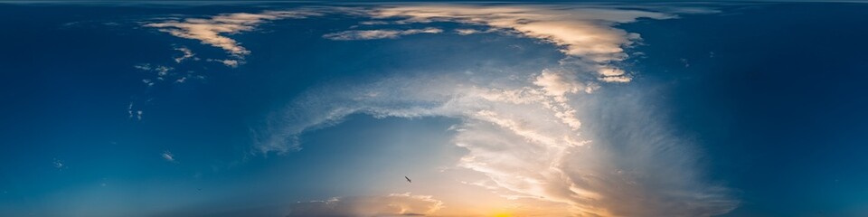 360 panorama of glowing sunset sky with bright Cirrus clouds. Seamless hdr spherical 360 panorama. Sky dome in 3D visualization, sky replacement for aerial drone panoramas. Weather and climate change