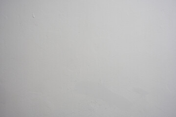 A plain white wall with a subtle texture and some minor water stains. Perfect as a clean...