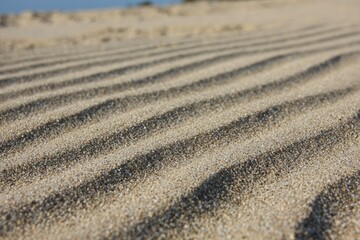 Close-up view of parallel sand patterns