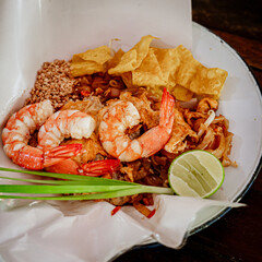 Pad Thai popular street food, Original thai food on a dark background and copy space.