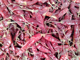 Dried Red Chili Peppers Bulk Stock Photo for Culinary and Spice Related Projects and Content Creators Featuring a Heap of Deep Red Peppers