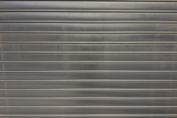Perforated metal grille shutter for urban security
