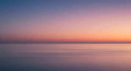 Fototapeta premium Blurry sunset over a calm sea