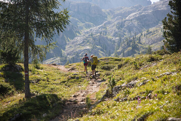Trekkers hiking in the Dolomite Mountains in Italy.