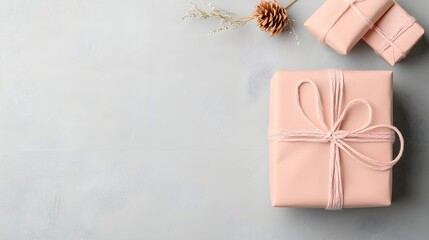 Pink Gift Box with Pine Cone on Holiday Background