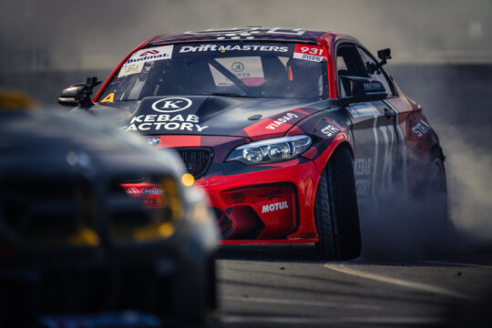 A Red Drift Car in Action on the Racetrack