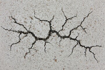 Fototapeta premium Cracked light gray surface