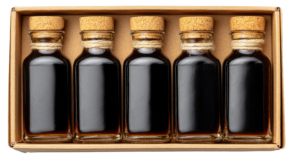 Small dark bottles of liquid in a craft box