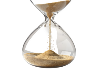 Hourglass with sand flowing against a black background