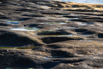 clear water in the rocks of the rocky ocean shore