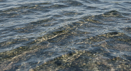 Obraz premium Rippled water over rocks