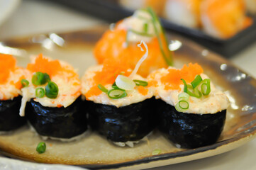 maki , Japanese roll or rice roll or seaweed roll with shrimp egg topping