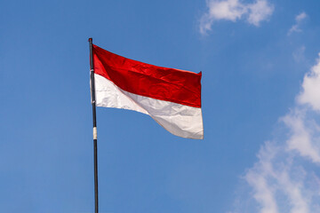 Indonesian flag in the blue sky,waving flag, indonesian Independence Day