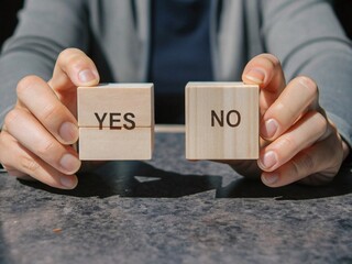 Choosing between yes and no, making a difficult decision in business