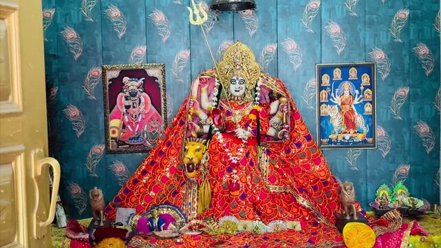 Durga Goddess, mata sitting on lion, Morph of kali hindu deity with trident in temple