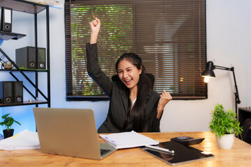 Asian businesswoman delighted with success in her career