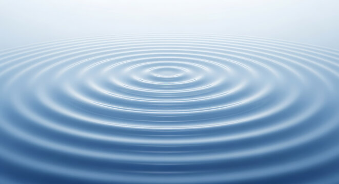 Calm blue water with concentric circles rippling outward from a central point.