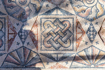 Ancient Roman mosaic floor with geometric and knot motifs, archaeological site in Bodrum, Turkey