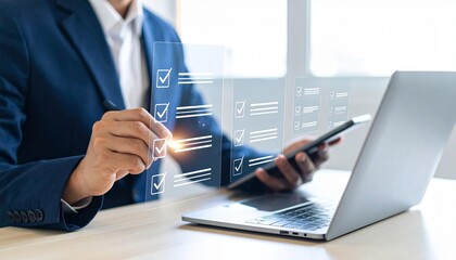 Professional man checks off tasks on a futuristic digital checklist while using a laptop for business success.