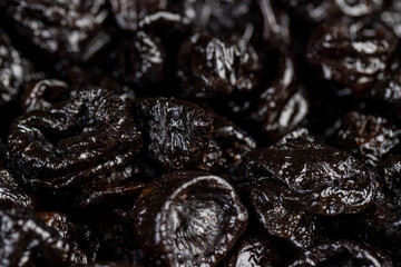 a large amount of prunes used in cooking, black prunes from small plums are dehydrated and pitted