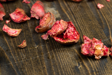 red ripe pomegranate on a black table