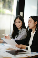 Asian businesswoman uses tablet to hold a meeting, discuss and exchange knowledge.