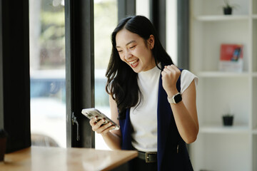 Two Asian businesswomen working together
