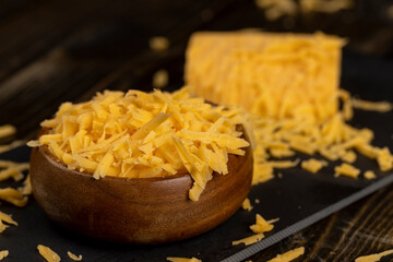preparation of dairy products during cooking, details of delicious cheese in small pieces, close up