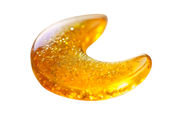 A translucent crescent shape made of thick, golden yellow liquid with tiny bubbles and sparkles, isolated on transparent background