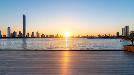 Obraz premium Sunset over skyline reflecting on water, creating serene atmosphere