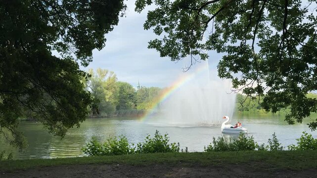 water fountain with rainbow in the schwanenteich park, zwickau east germany 4k