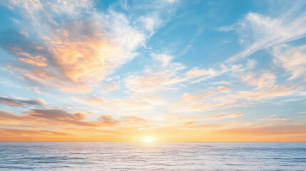 Fototapeta premium Vibrant sunset sky with warm orange and pink tones reflecting on calm ocean waves