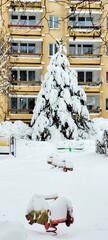 Winter Wonderland A Beautiful SnowCovered Playground with a Majestic Tree at Its Center