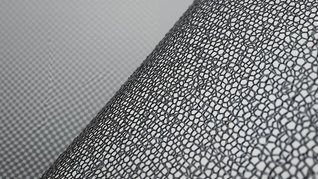 Close-up shot of a thin metal grid with numerous tiny openings