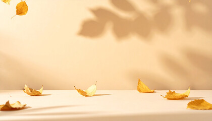 Minimal autumn background with warm beige tones, scattered golden leaves, soft shadows, neutral flat surface with copy space, perfect for Instagram posts, product placement, or modern seasonal ads.
