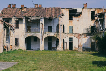 Abandoned Industrial Chimney Tower with Overgrown Vegetation