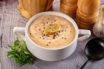 Tasty cheese cream soup with crouton