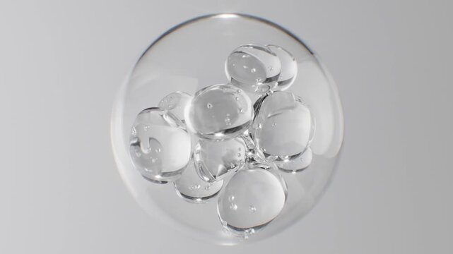 Abstract cosmetic background with glass spheres and bubbles inside a larger orb. Hyaluronic acid, serum, or the molecular structure of a hydrating essence motion science concept.