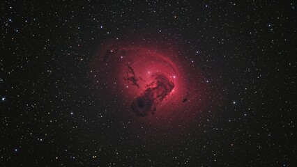 Image showcasing the scarlet Butterfly Nebula amidst a sparkling night sky