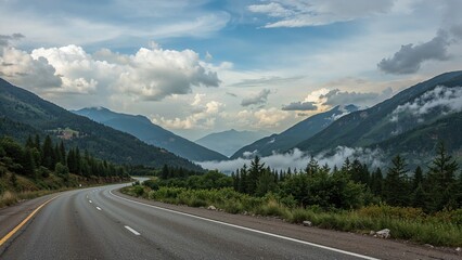 Morning scene of a tarmac road traversing green hills with a cloudy sky