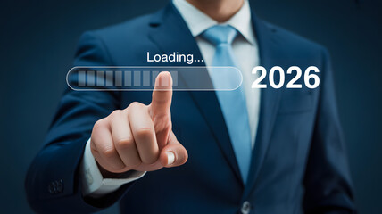 Businessman initiates future progress by touching loading bar towards 2026 goals