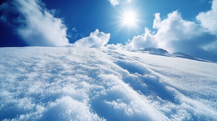 Snow-covered landscape under a bright blue sky