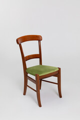 This is a Classic Wooden Chair that comes with a plush Green Cushion for added comfort