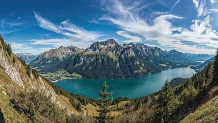 Fototapeta premium Scenic mountain backdrop overlooking a clear alpine lake in a beautiful Austrian area