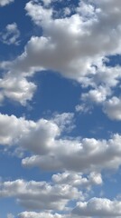 Obraz premium Fluffy White Clouds Against A Bright Blue Sky