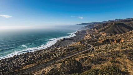 Top-down image of a coastal road beside rocky terrain