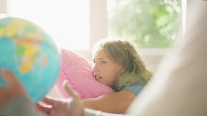 Happy girl school student study looking at globe and discussion with teacher in classroom. Children kid enjoy and fun geography class learning for development knowledge education at primary school. - Powered by Adobe