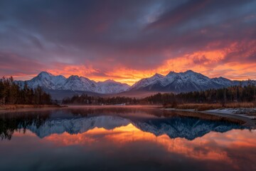 Fototapeta premium Sunrise Reflections On Alpine Lake With Snowy Mountains
